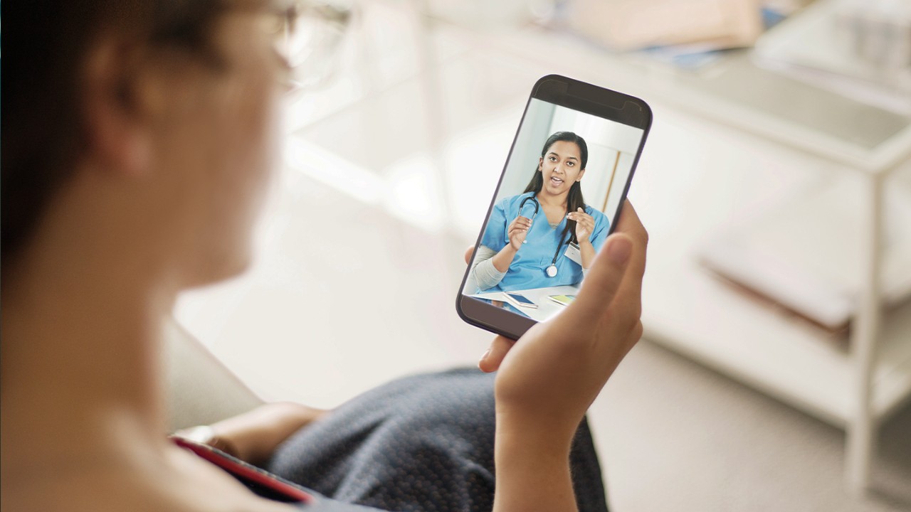 Woman talking with healthcare professional on her smartphone.