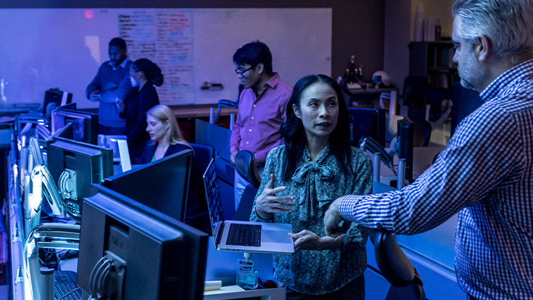 group of workers in a cyber control center